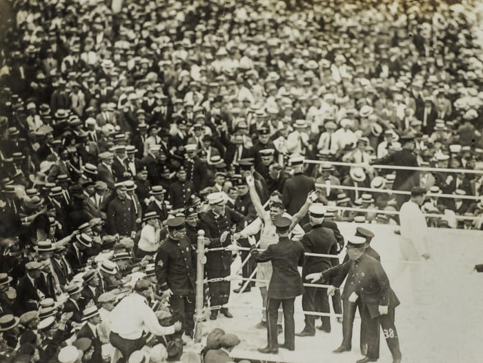 Dempsey had Carpentier on the ropes before celebrating his fourth round knockout.